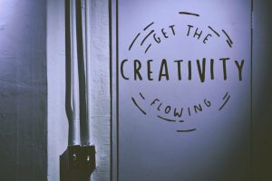 A sign etched on the wall reads let the creativity flow. It's in a circle.