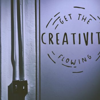 A sign etched on the wall reads let the creativity flow. It's in a circle.