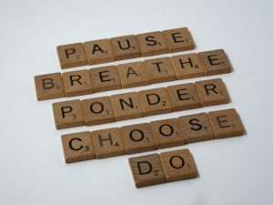 scrabble tiles read pause, breathe, ponder, choose, do